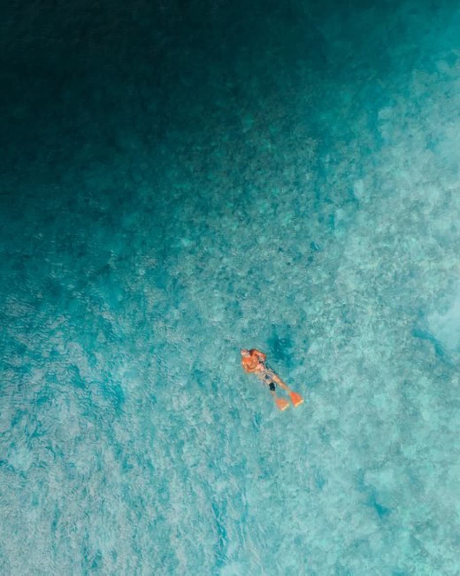 Snorkeling over a reef in clear turquoise water
